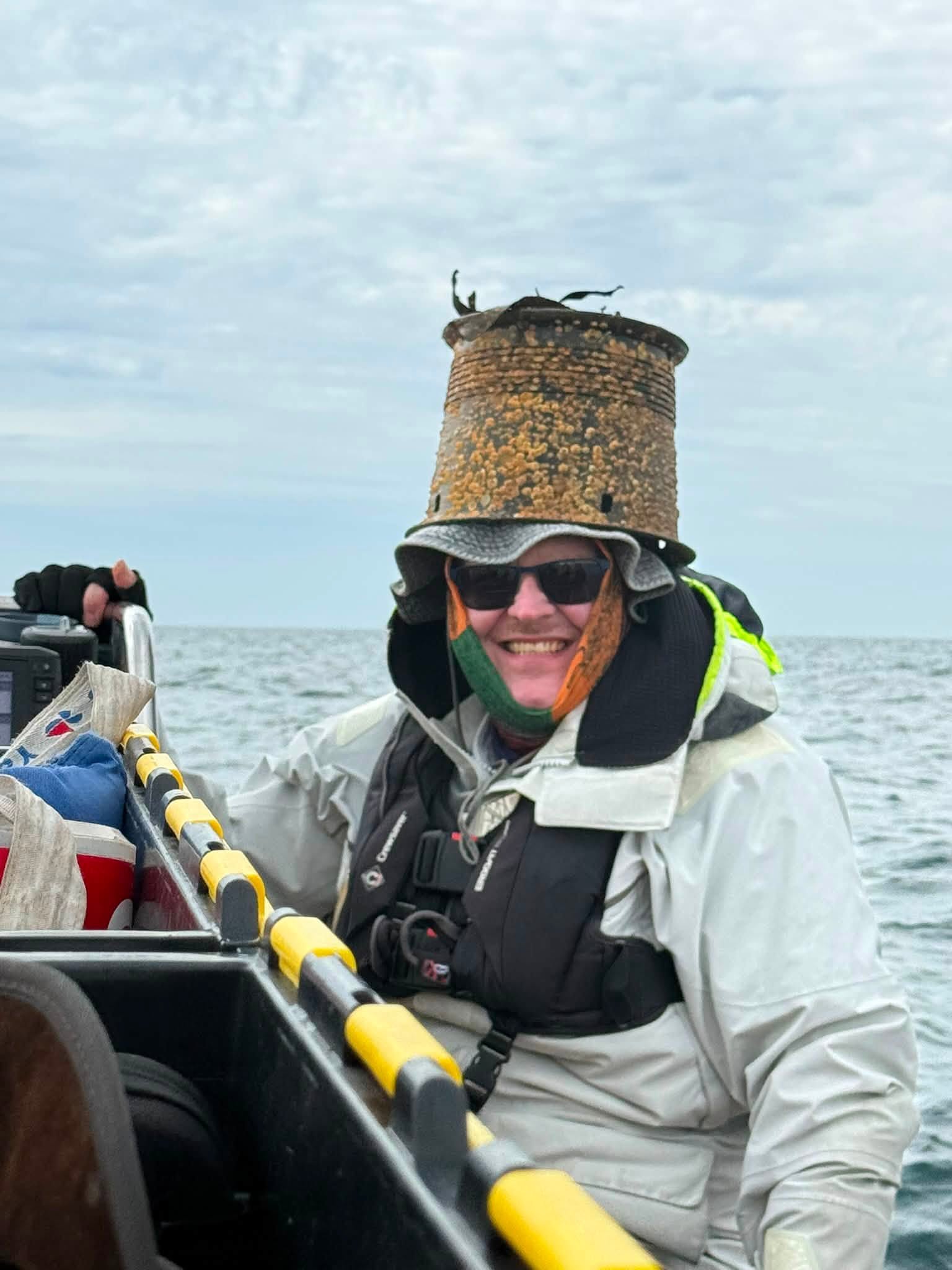 May be an image of kayak and hat